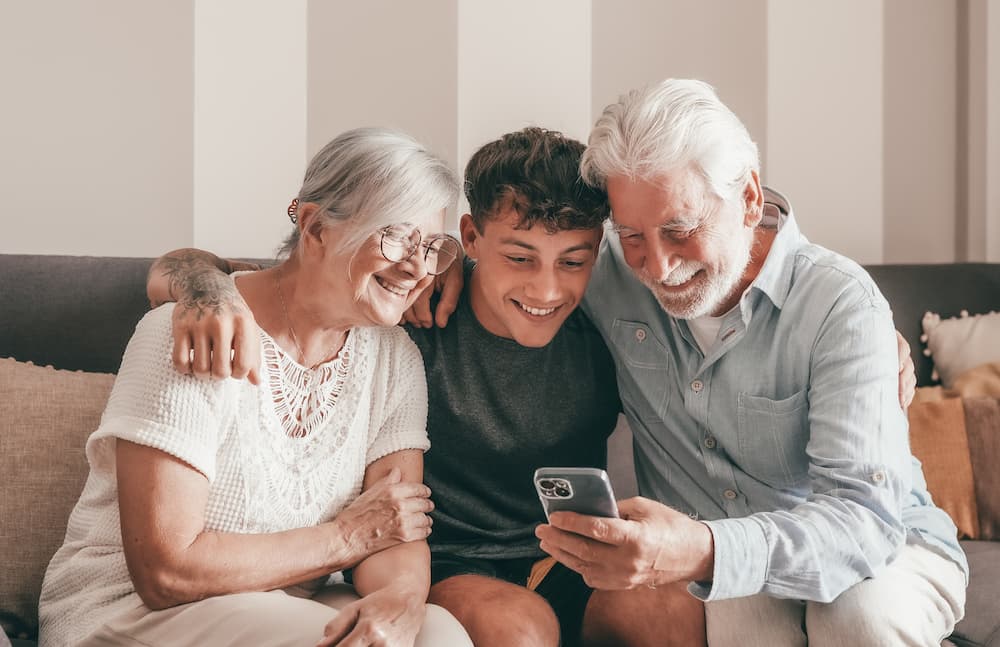 grandparents connecting with their grandchild through technology